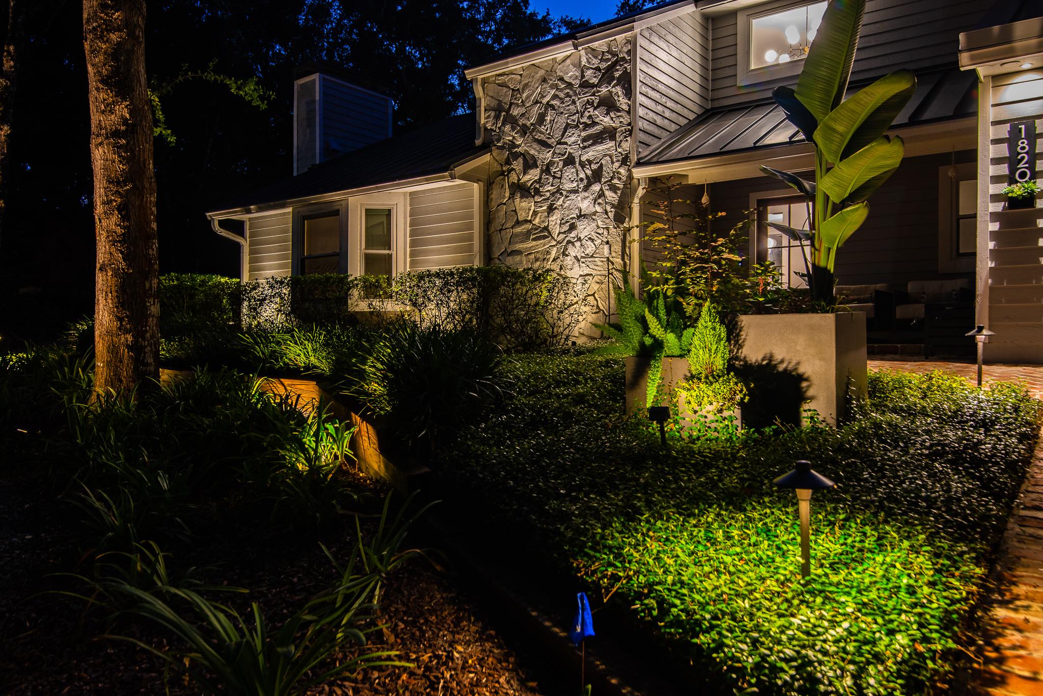 A house with a garden at nightDescription automatically generated
